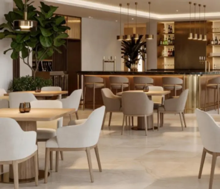 Luksusowy wystrój restauracji Velastrelio z jasnym drewnem i mosiężnymi akcentami